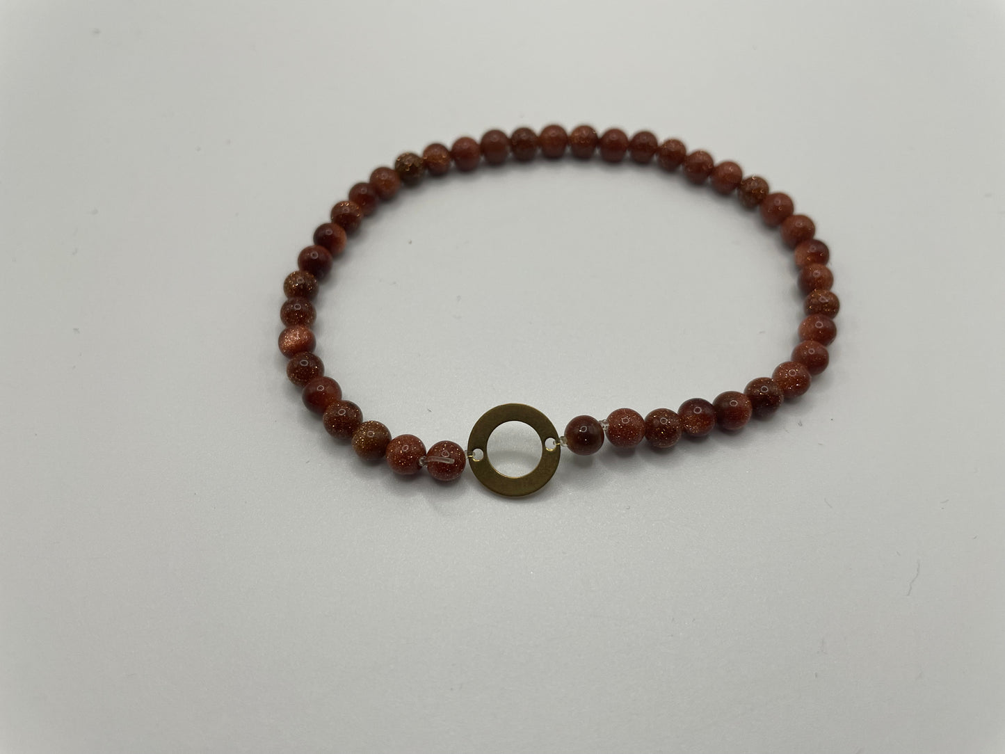 Goldstone Beaded Bracelet with Brass Circle Charm