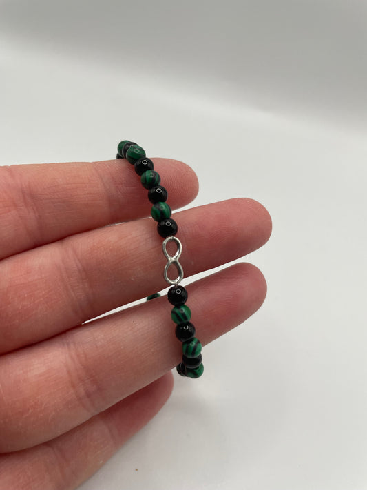 Green and Black Beaded Bracelet with Infinity Charm