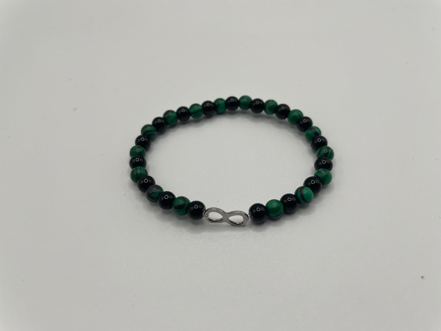 Green and Black Beaded Bracelet with Infinity Charm