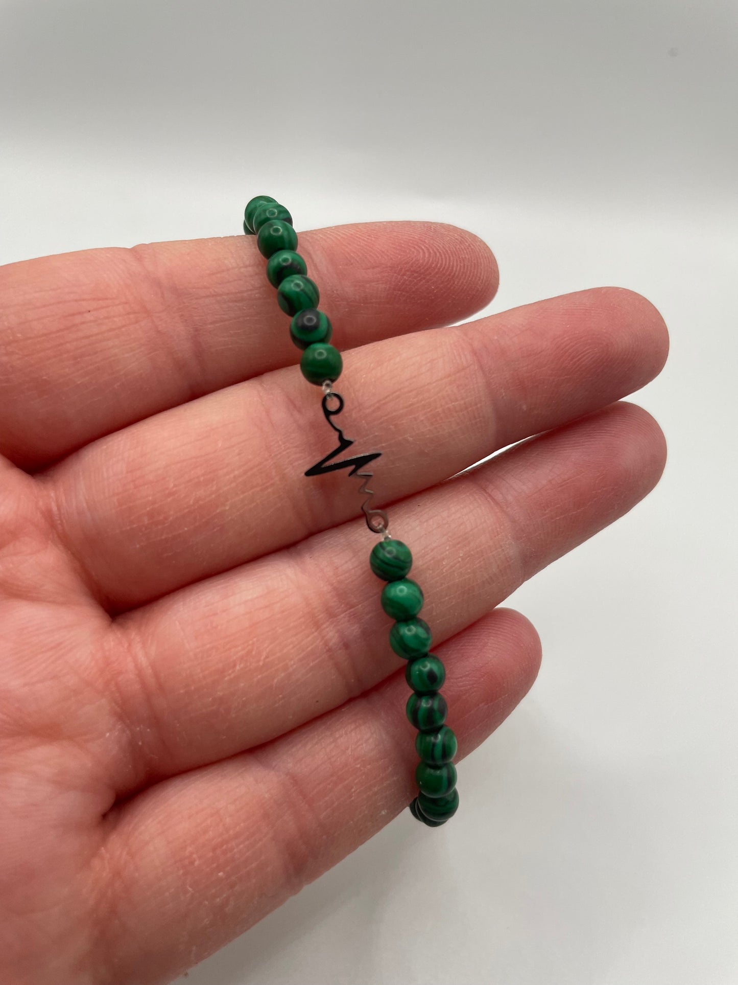 Green Beaded Bracelet with Heartbeat Charm