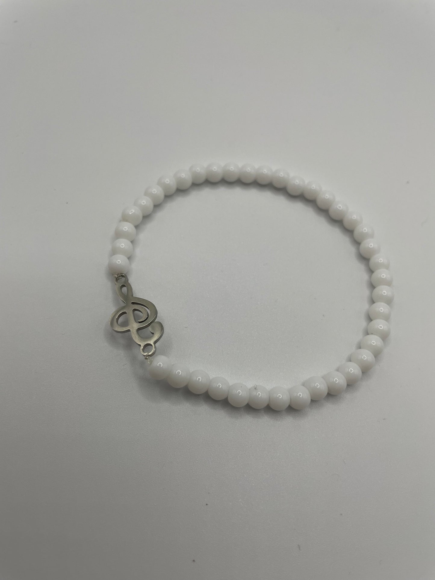White Beaded Bracelet with Treble Clef Charm
