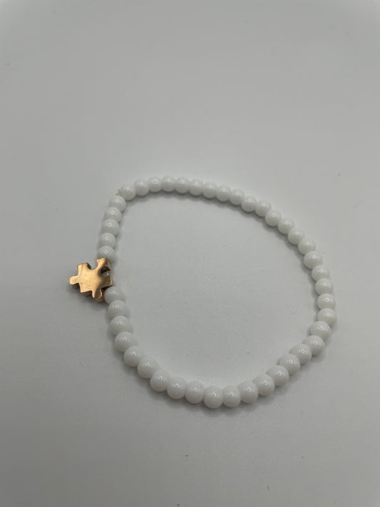 White Beaded Bracelet with Rose Gold Puzzle Charm