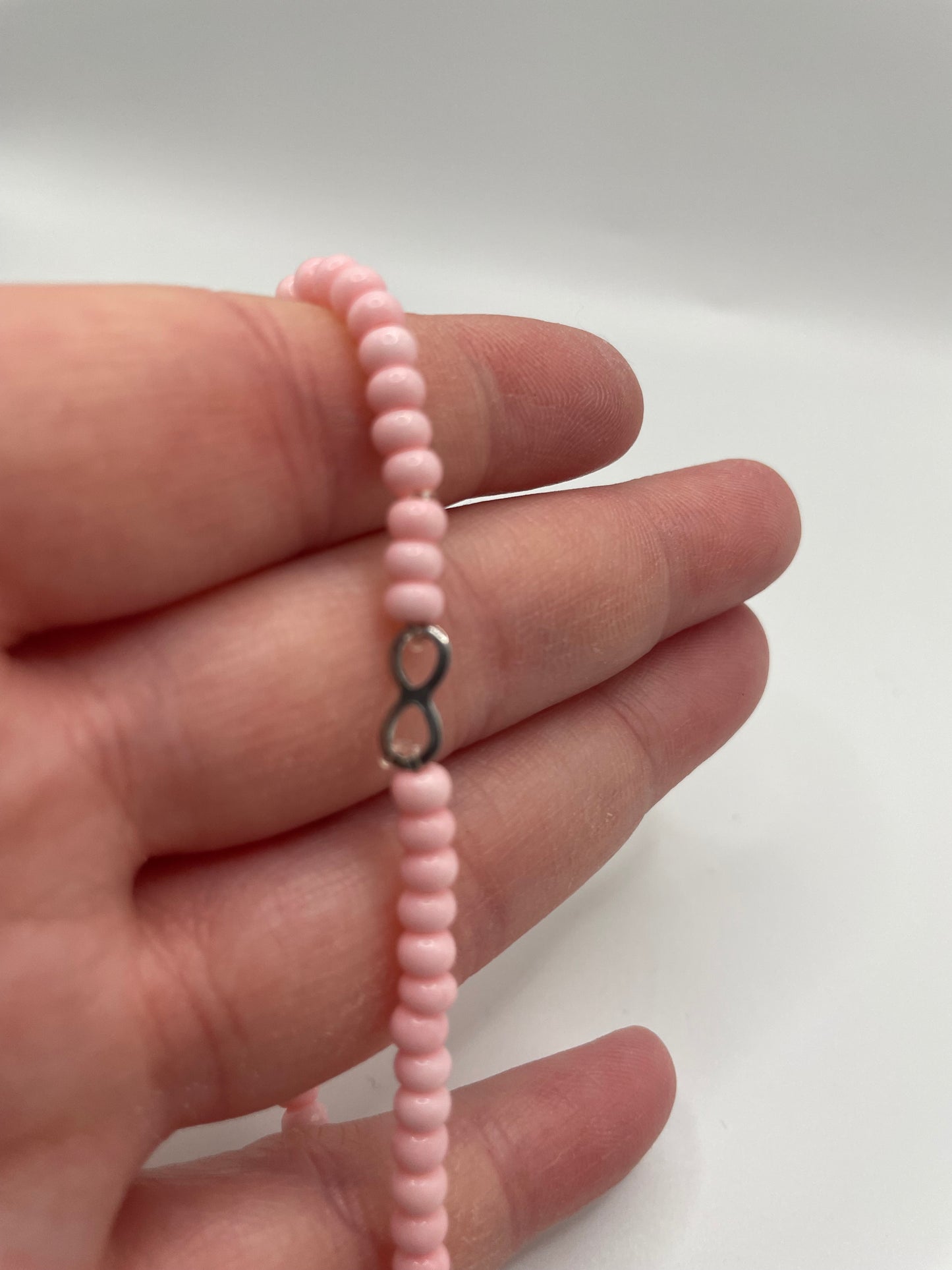 Pink Beaded Bracelet with Infini charm