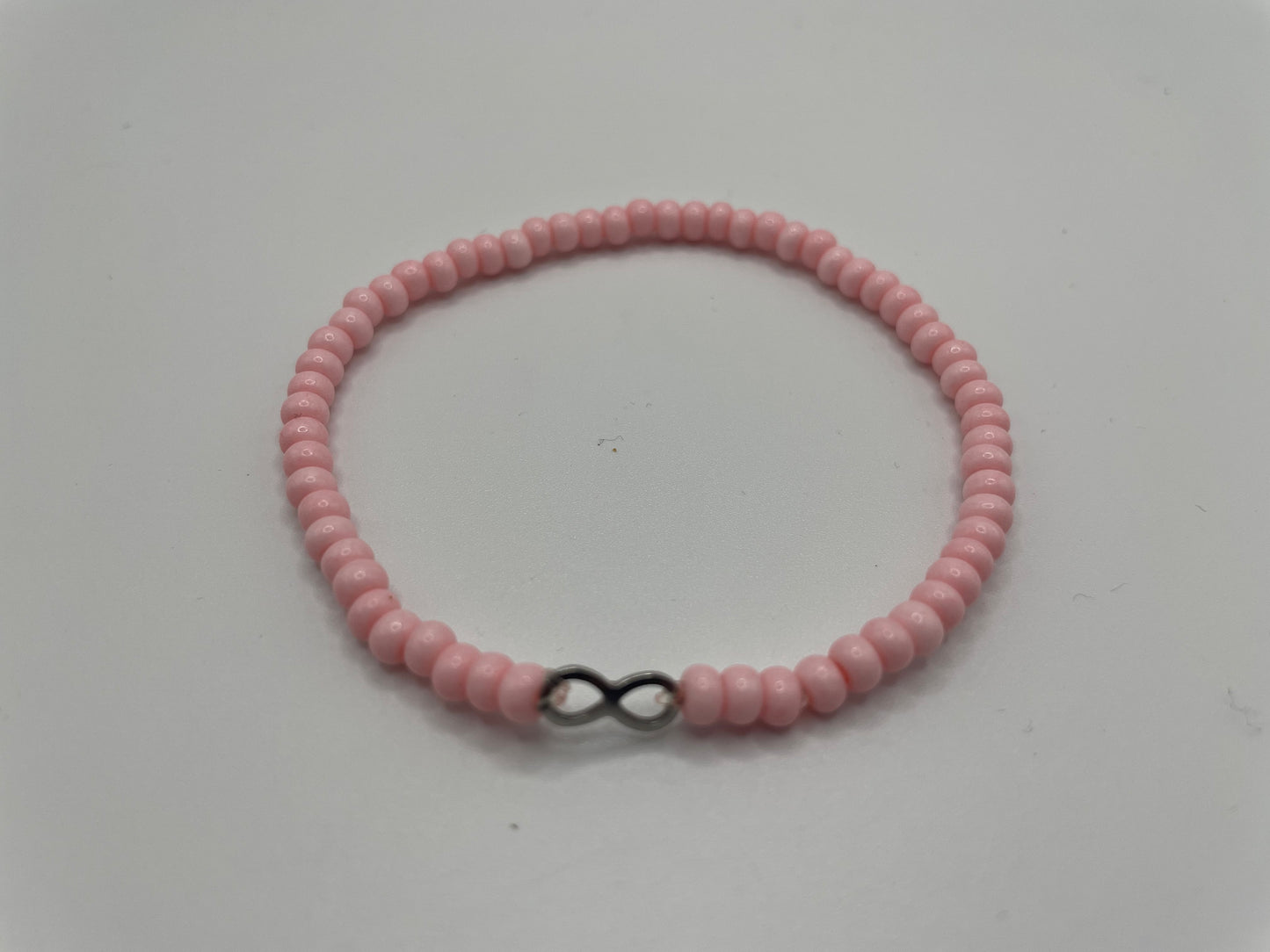 Pink Beaded Bracelet with Infini charm