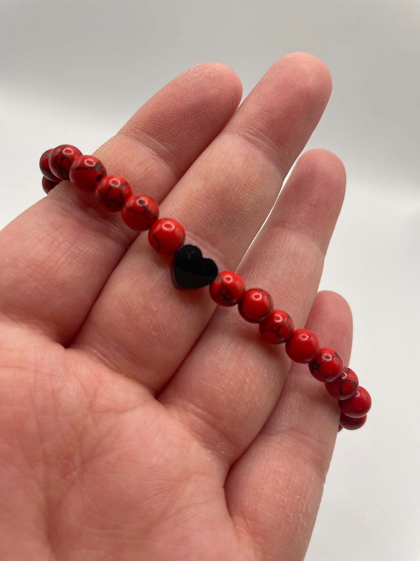 Red Beaded Bracelet with Black Heart Charm
