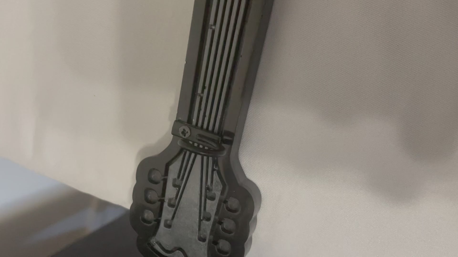 black and grey guitar key holder