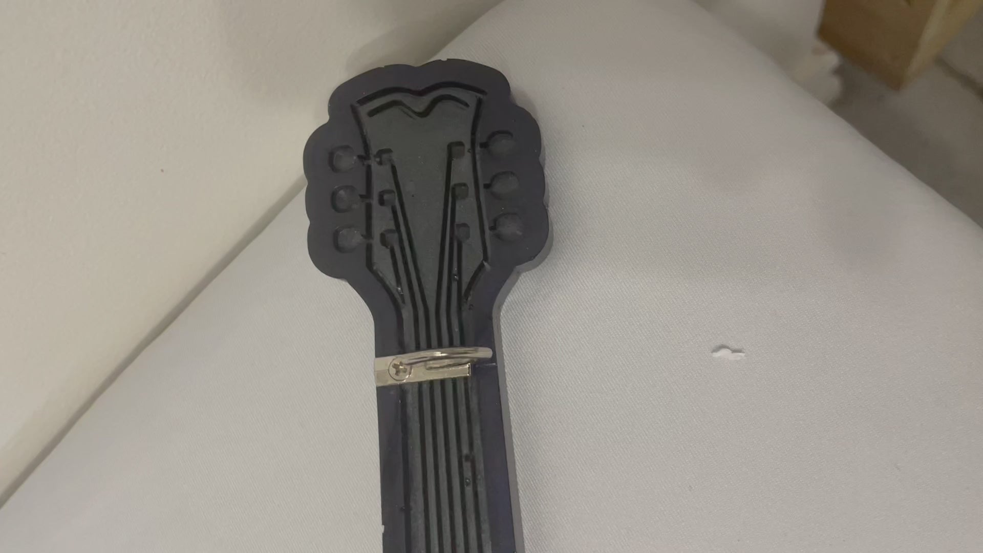 navy blue and grey guitar key holder