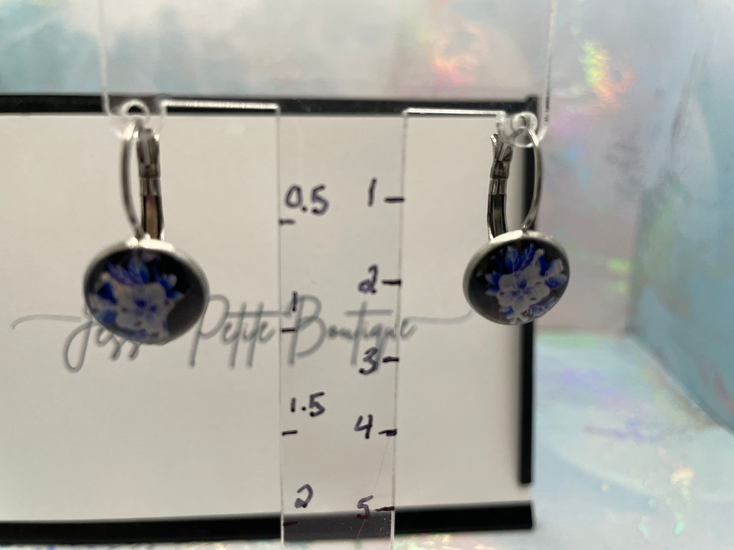 Pair of earrings on a measurement card with 'JESSIE PETITE Boutique' branding.