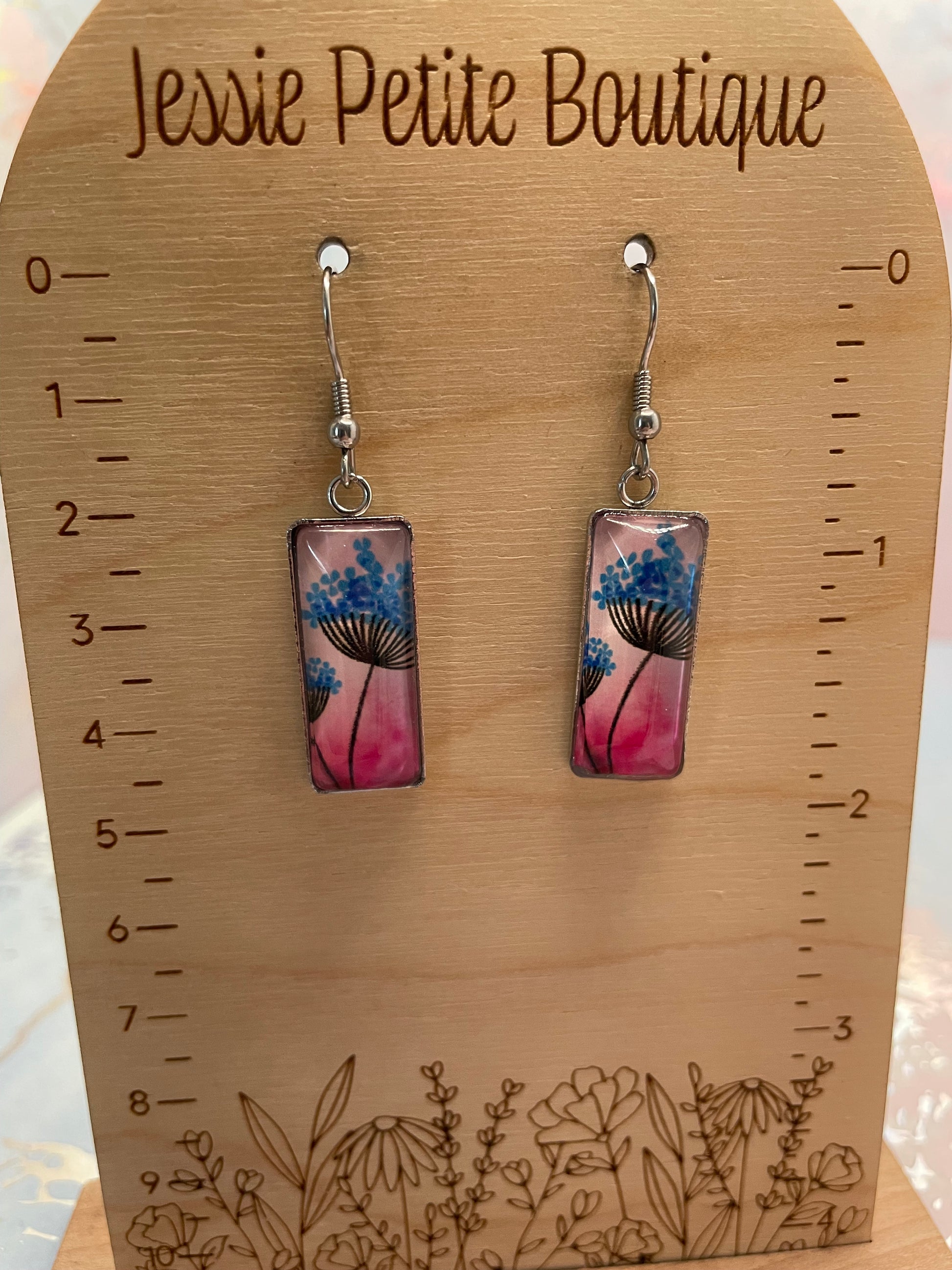 Rectangular earrings with floral design on a wooden card with measurements and 'Jessie Petite Boutique' branding.