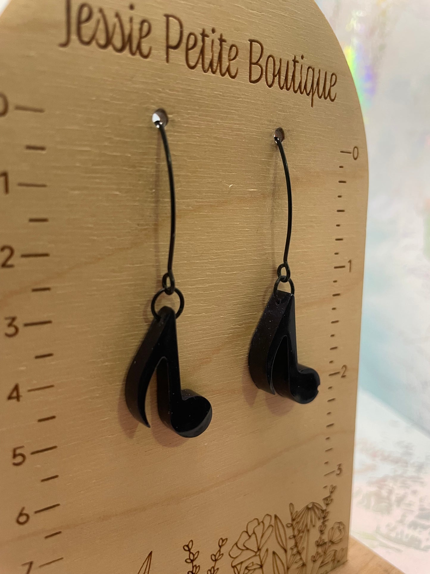 Dark Blue earrings on a wooden board with measurement scale and 'Jessie Petite Boutique' branding.