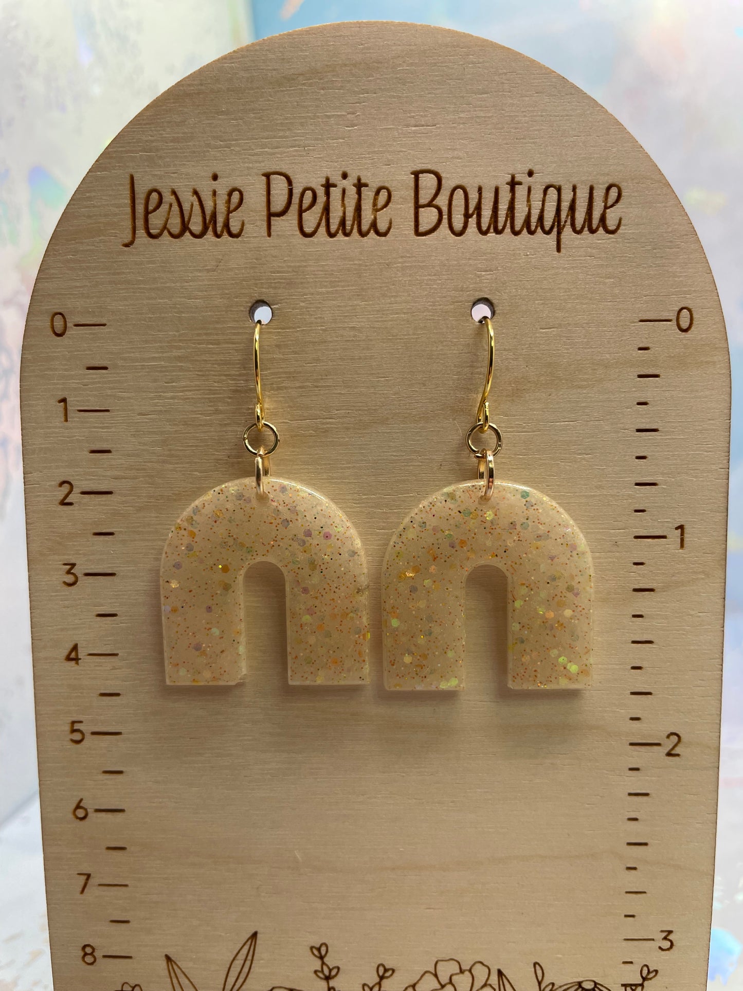 Boucles d'oreilles arche champagne scintillantes