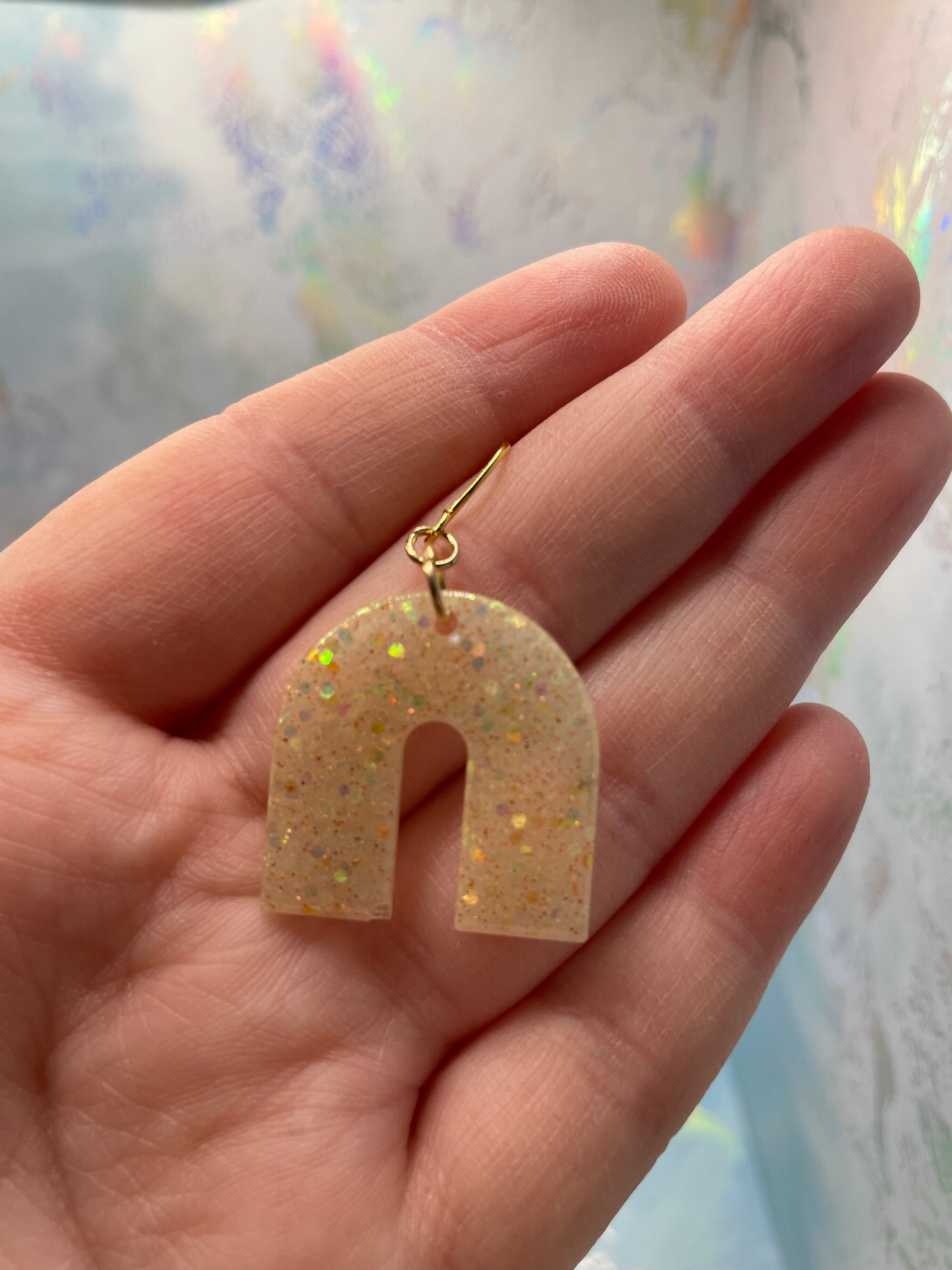 Boucles d'oreilles arche champagne scintillantes