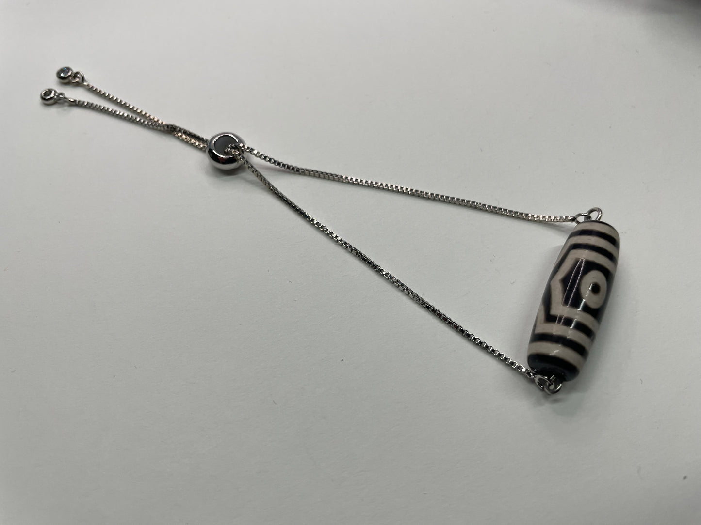 Bracelet ajustable bille géométrique noir et ivoire