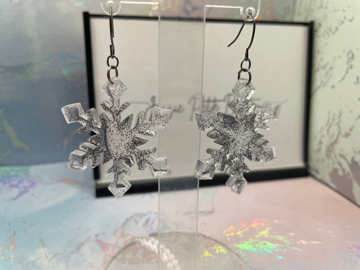 Boucles d'oreilles flocon de neige gris scintillant