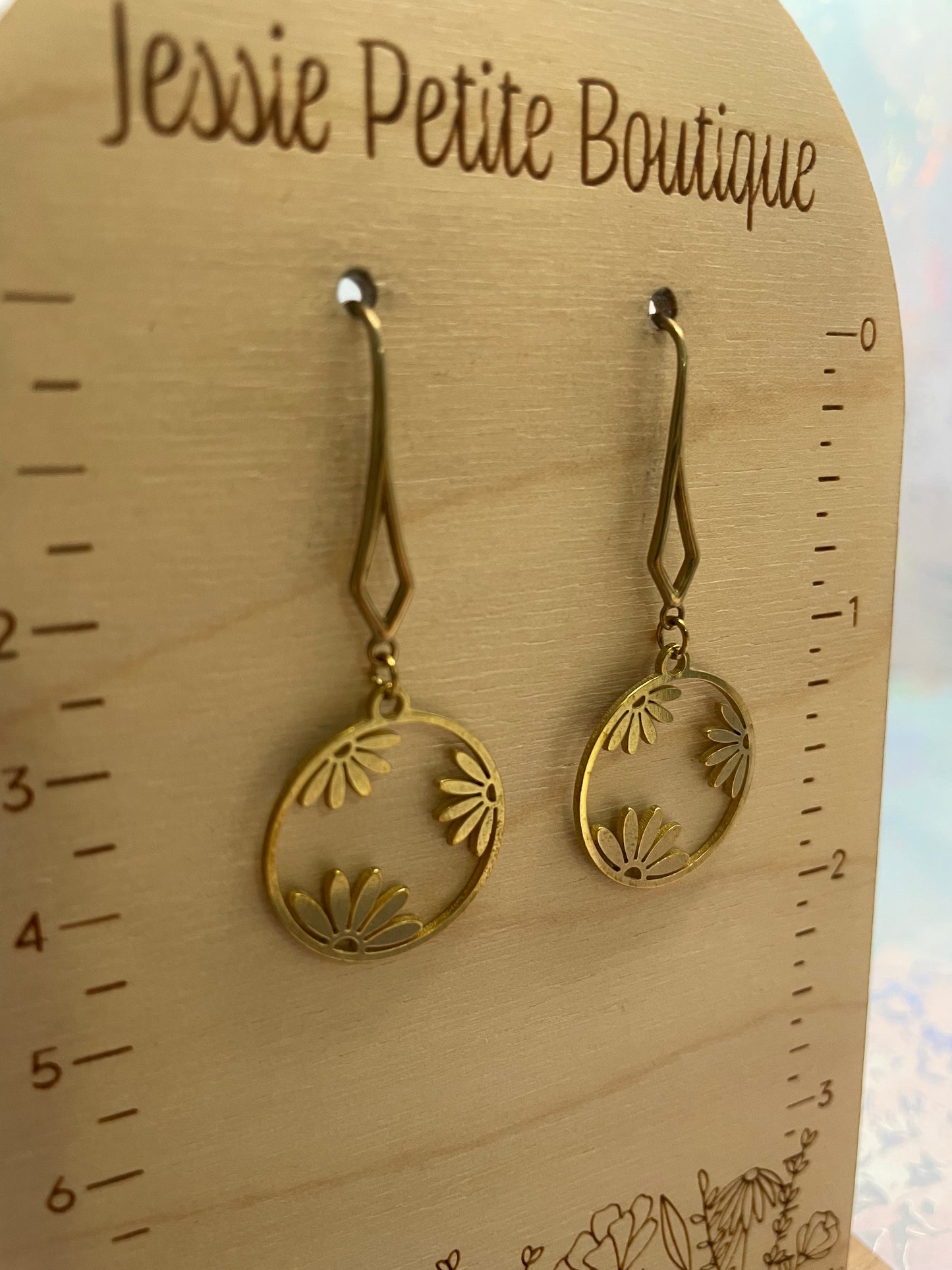 Boucles d’oreilles cercle floral dorée