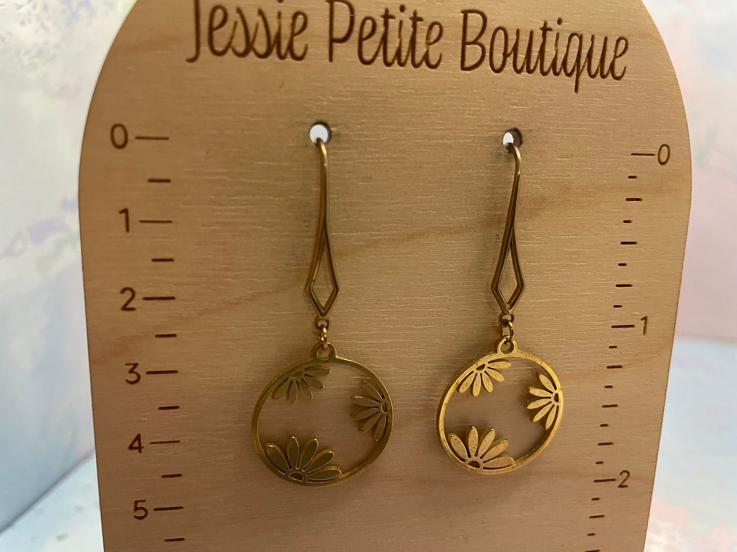Boucles d’oreilles cercle floral dorée