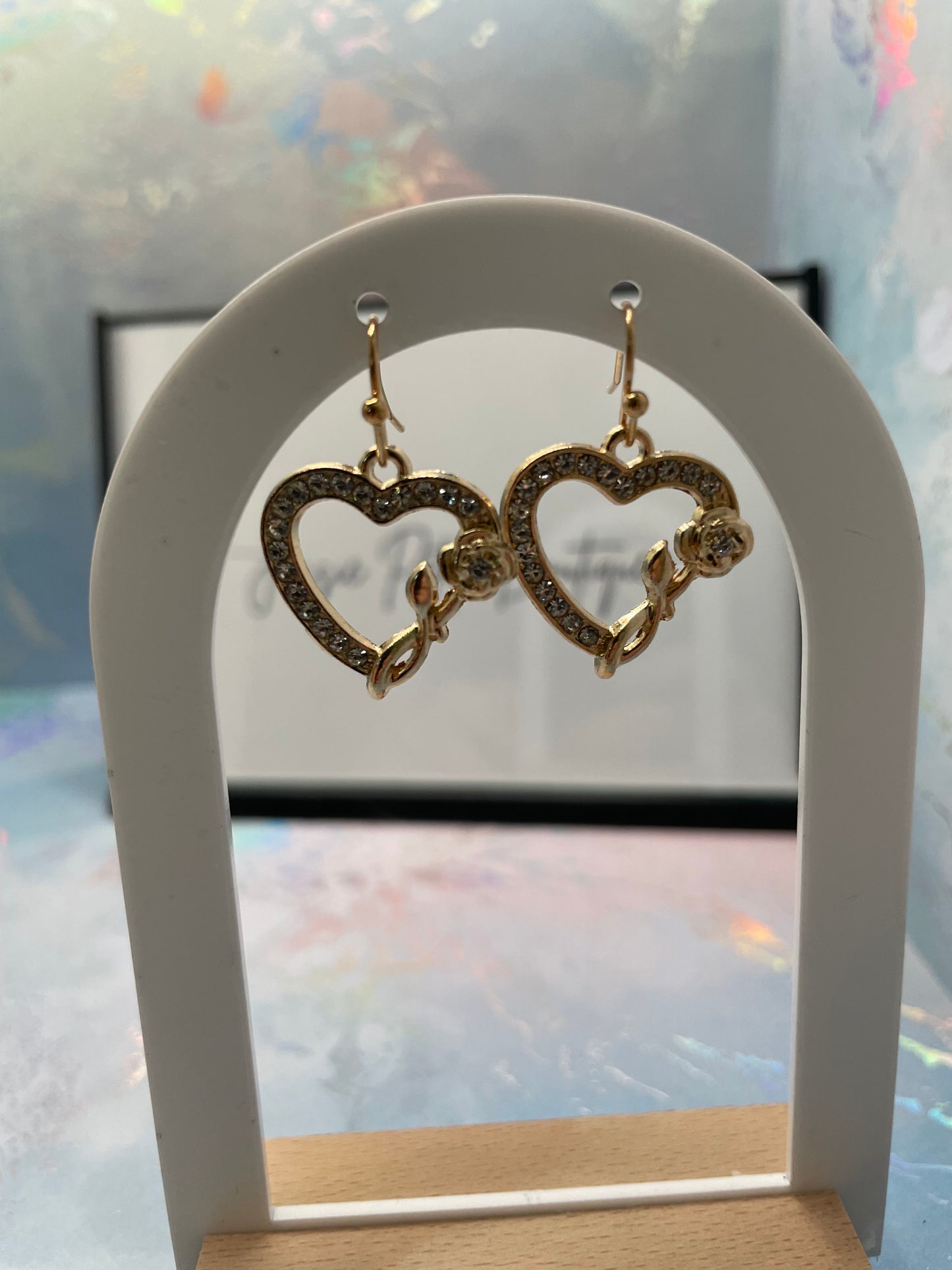 Boucles d'oreilles cœur en zircone avec rose dorée