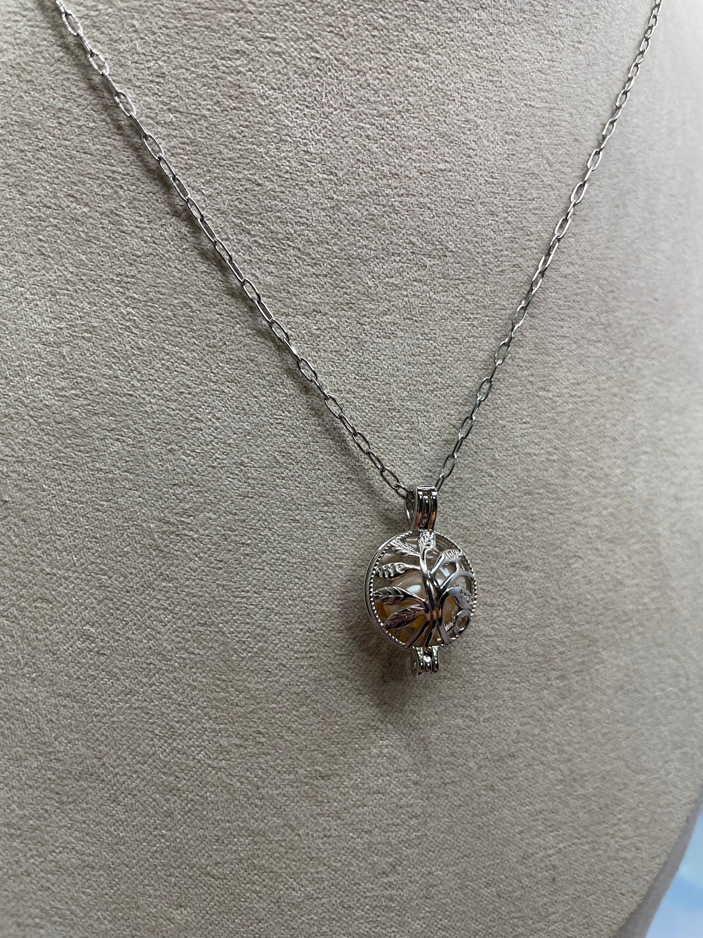 Collier cage arbre de vie avec perle rose