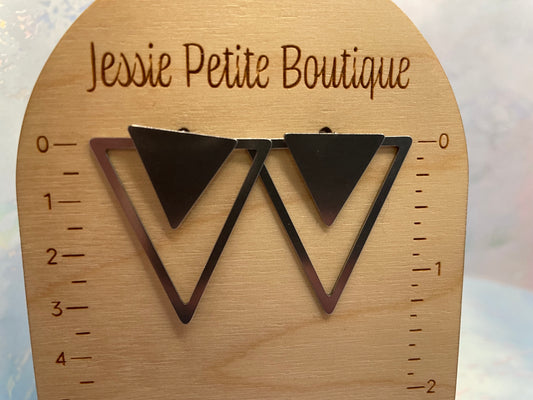 Triangular earrings on a wooden display card with 'Jessie Petite Boutique' branding.