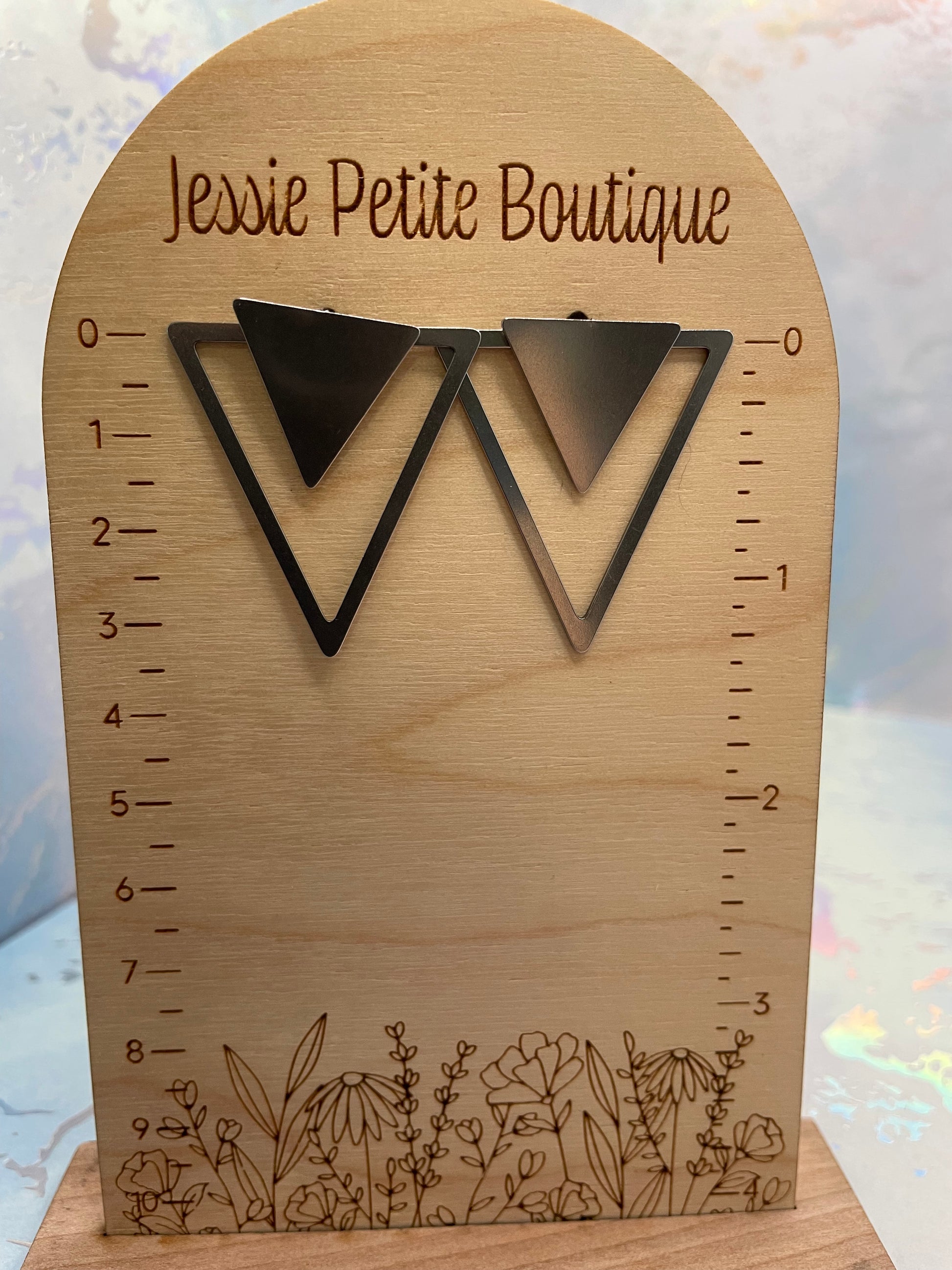 Silver-Convertible Triangle Earrings on engraved floral design and 'Jessie Petite Boutique' branding