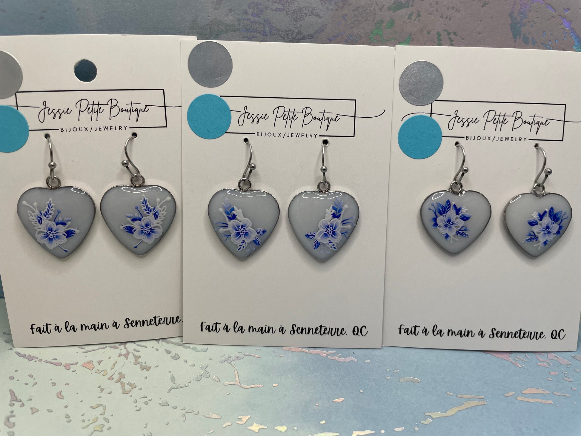 Heart-shaped earrings with floral design on cards from Jessie Petite Boutique.
