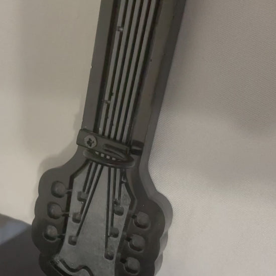 black and grey guitar key holder 