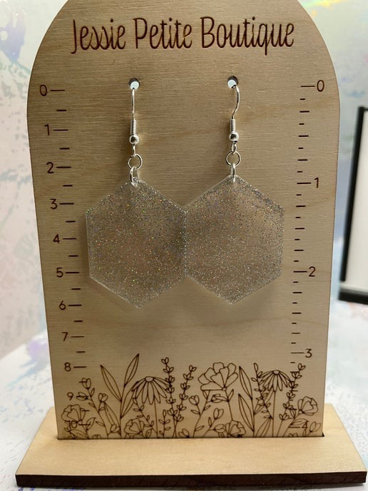 Hexagonal earrings on a wooden display card with 'Jessie Petite Boutique' branding.