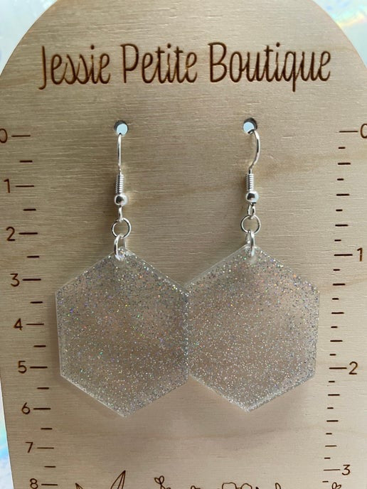 sparkly Hexagonal earrings on a wooden display card with 'Jessie Petite Boutique' branding.