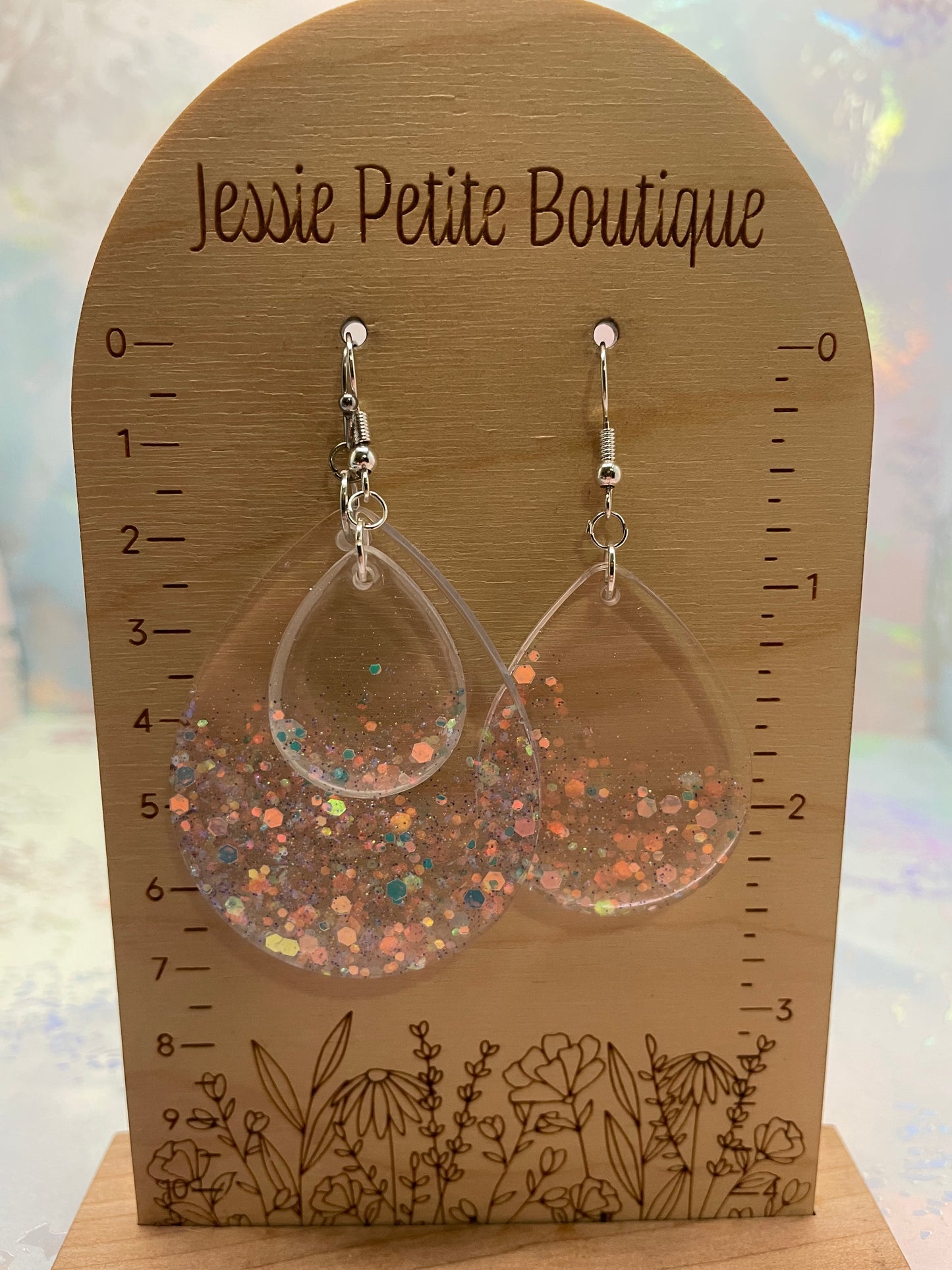 earrings on a wooden card with 'Jessie Petite Boutique' branding
